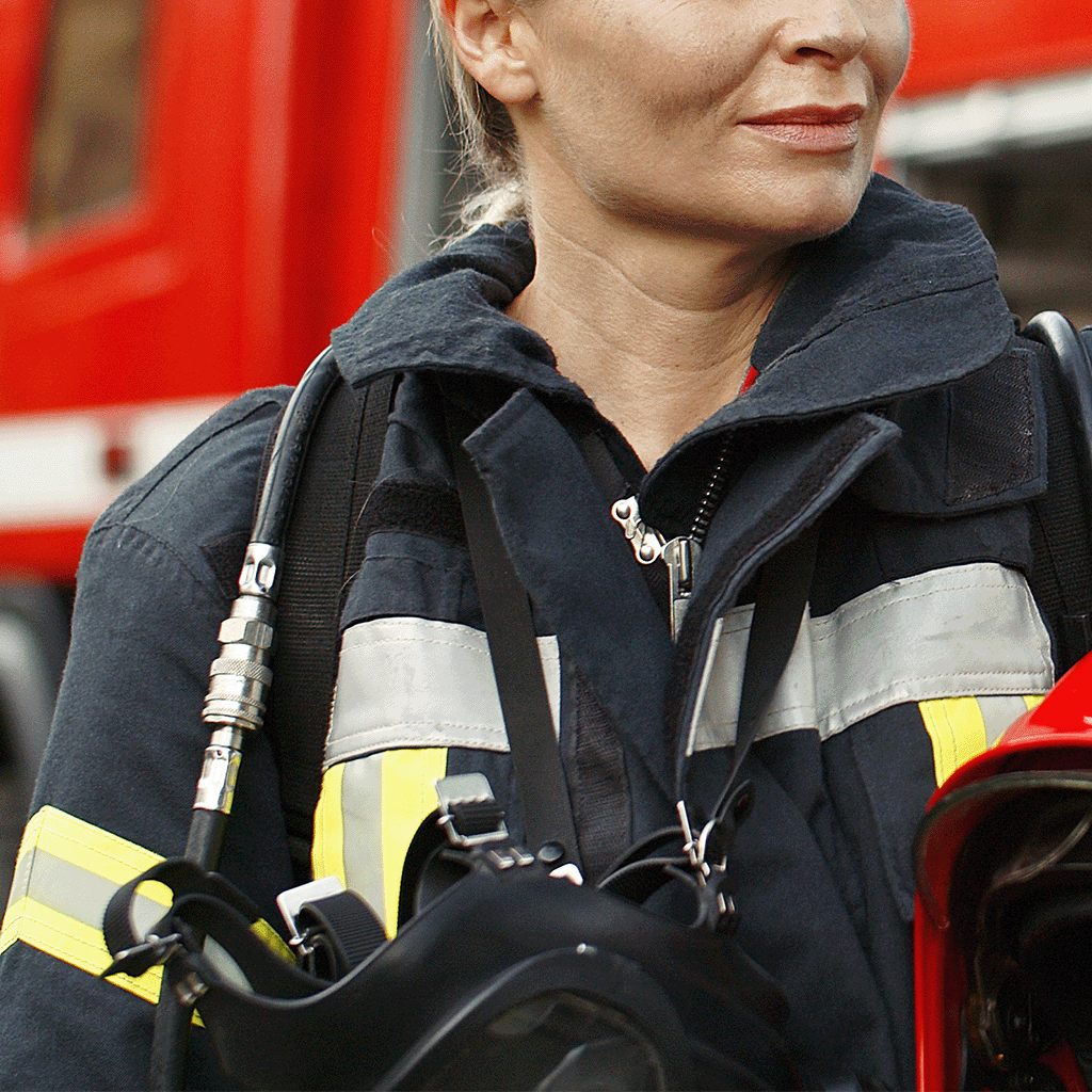 A photograph of a female firefighter wearing the type of protective clothing that can benefit from LunaMicro's active moisture management technology.